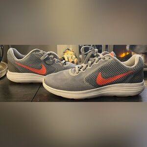 Nike grey and orangee running shoes